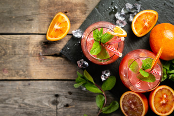 Bloody orange drink and ingredients, copy space