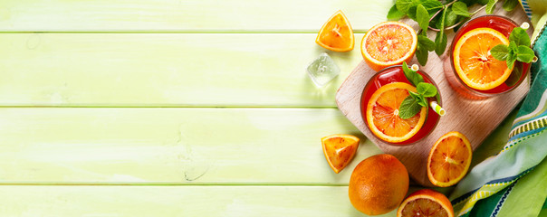 Bloody orange drink and ingredients, copy space