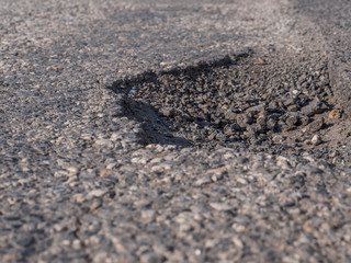 Schlagloch in der Straße