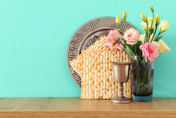 Pesah celebration concept (jewish Passover holiday) over wooden table