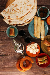 Middle eastern or arabic dishes and assorted meze, concrete rustic background. Turkish Bread or Turkish pizza. Dessert Baklava with pistachio. falafel with hommos.  Halal food. Lebanese cuisine
