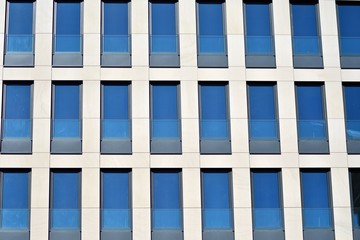 Fragment of abstract architecture - modern urban beauty geometry. Blue glass wall.