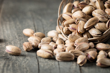 Healthy mix nuts on wooden background. Almonds, hazelnuts, cashews, peanuts, pistachios, brazilian nuts