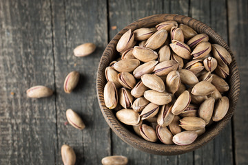 Healthy mix nuts on wooden background. Almonds, hazelnuts, cashews, peanuts, pistachios, brazilian nuts