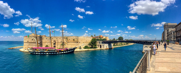 Overview of the Italian training ship Palinuro docked at the Aragonese Castle with a view of the...