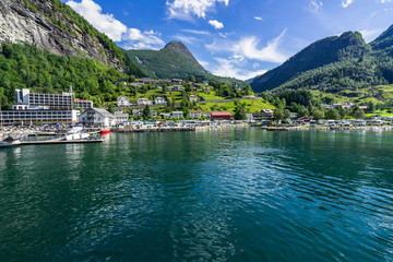 Fototapeta na wymiar View of the Geiranger village in sunny day, located at the head of Geirangerfjord, one of the most famous destination in Norway