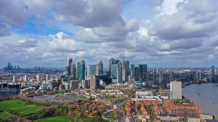 Aerial bird's eye panoramic photo taken by drone of iconic Canary Wharf skyscraper complex and...