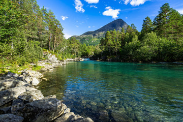 Fototapeta na wymiar Clear waters of the Valldola River in the beautiful nature of Valldalen Valley, Sunnmore, More og Romsdal, Norway