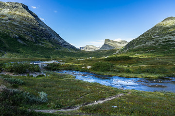 Naklejka na ściany i meble Small river at the upper part of the Valldalen Valley towards Trollstigen, Sunnmore, More og Romsdal, Norway