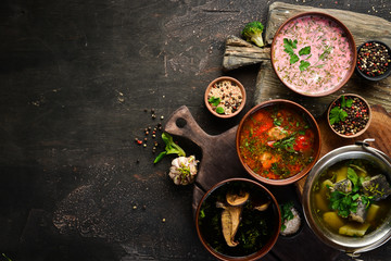 Ukrainian cuisine. Borsch soup with mushrooms, fish soup. Top view. Free space for your text. Rustic style.