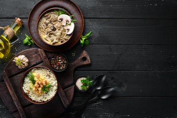 Ukrainian cuisine. Banosh with bacon and mushrooms. Top view. Free space for your text. Rustic style.