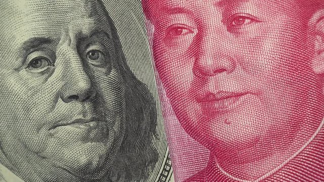China yuan and US dollar bill rotating. Chinese and USA trade. 4K stock video footage