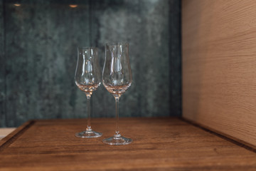glass of white wine on wooden table