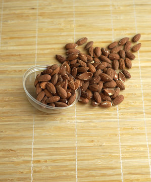 Healthy food  for background image close up almond nuts. Texture Nuts on the cup plate