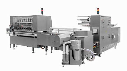 Industrial line for packaging of bakery products. Packing of bread at the factory.The machine for...