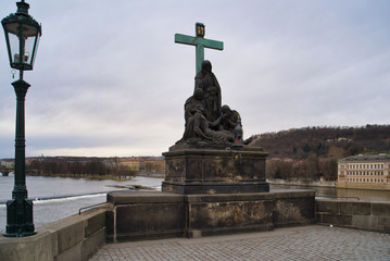 Fototapeta premium Prague, Czech Republic - March 04, 2019: Sculpture on the Charles Bridge - Lamentation of Christ, an episode of the Passion of Christ