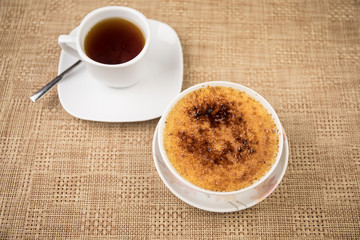Sweet cheesecake in plate on a table. Dessert prepared in Japanese style.