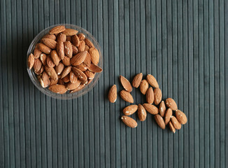Healthy food  for background image close up almond nuts. Texture Nuts on the cup plate