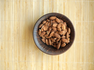 Healthy food  for background image close up almond nuts. Texture Nuts on the cup plate