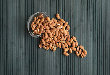 Healthy food  for background image close up almond nuts. Texture Nuts on the cup plate