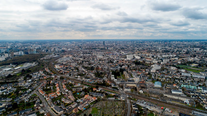 Fototapeta na wymiar Aerial view of Nantes city on a cloudy day, France