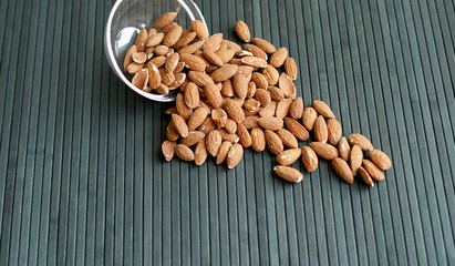 Healthy food  for background image close up almond nuts. Texture Nuts on the cup plate