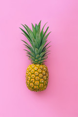 Pineapple tropical fruit on pink pastel background