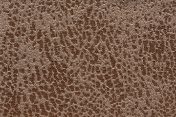 Relief textile background in beige tone.