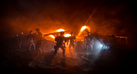 War Concept. Military silhouettes fighting scene on war fog sky background, Fighting silhouettes Below Cloudy Skyline At night. Battle scene. Army vehicle with soldiers. army