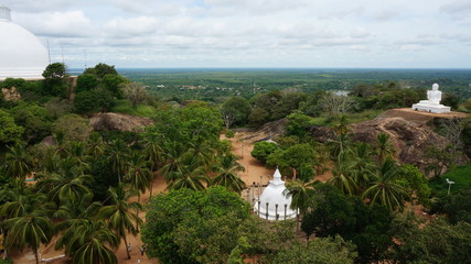 Mihintale, Sri Lanka Big white Buddha statue against blue sky in Mihintale, the cradle of buddhism...