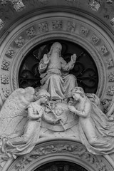 Fototapeta premium Religious statue with god and two angels