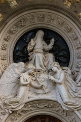 Religious statue with god and two angels