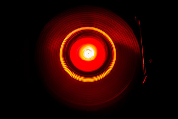 Concept of speed - Trail of fire and smoke - Vinyl record. Burning vinyl disk. Turntable vinyl record player. Retro audio equipment for disc jockey. Sound technology