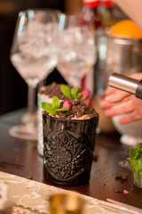 female bartender preparing cocktail in a cocktail bar