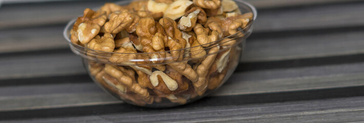 Healthy food  for background image close up walnuts.  Nuts  texture on top view on the cup plate