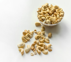 Healthy food  for background image close up cashew nuts.  Nuts texture on white grey table top view on the cup plate