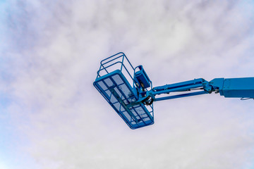 Cloudy sky over a boom lift in Eagle Mountain Utah © Jason