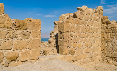 detail of the entrance of the ancient roman fortress that sits above the dead sea resort town of ein bokek in israel showing the pattern and texture of the stone walls