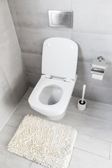 White ceramic toilet at luxury bathroom