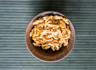 Healthy food  for background image close up walnuts.  Nuts  texture on top view on the cup plate