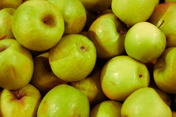 Delicious green apples as background. Close-up shooting