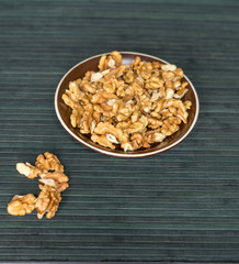 Healthy food  for background image close up walnuts.  Nuts  texture on top view on the cup plate