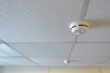 Fire alarm sensor hanging on the ceiling
