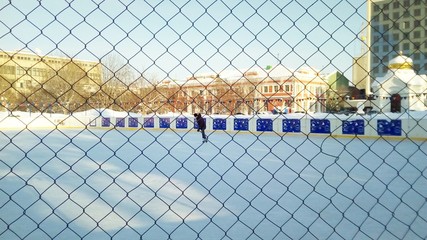 view of the rink through the fence