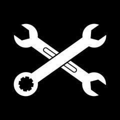 Two crossed wrenches on black background