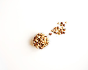 Healthy food  for background image close up hazelnuts.  Nuts texture on white grey table top view on the cup plate