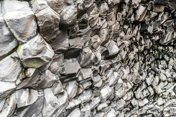 Perspective view of Basalt cliffs pattern inside the cave in the bottom of Reynisfjall mountain in Southern Iceland.