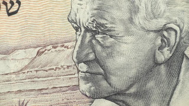 David Ben-Gurion on old Israel shekel macro rotating. First Prime Minister of Israel. 4K stock video footage
