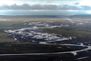 The course of Skaftafellsa glacial river viewed from  Skaftafellsjokull glacier in Skaftafell National Park of south-eastern Iceland.