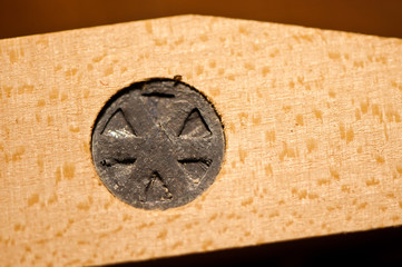 Closeup of lead weights in piano key